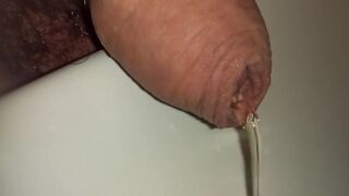 uncutted foreskin close up while peeing kinky pees everywhere