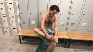 playing with feet and dick in the locker room
