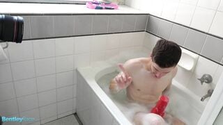 Brad Hunter playing with his thick cock in the bath